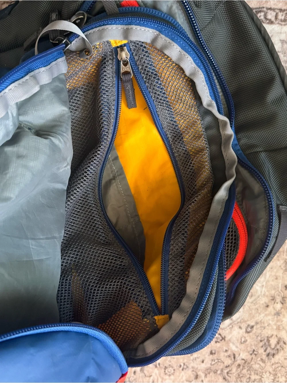 cotopaxi Light Blue Backpack with Red, Orange, Teal & Purple Accents